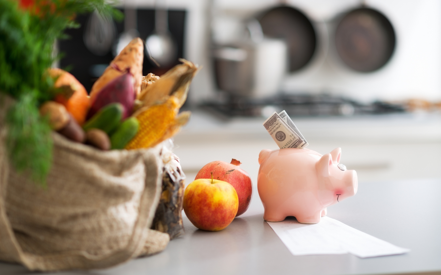 piggy bank next to groceries